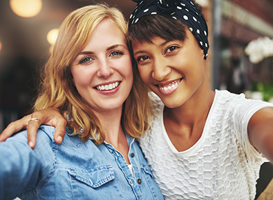 Two smiling women.